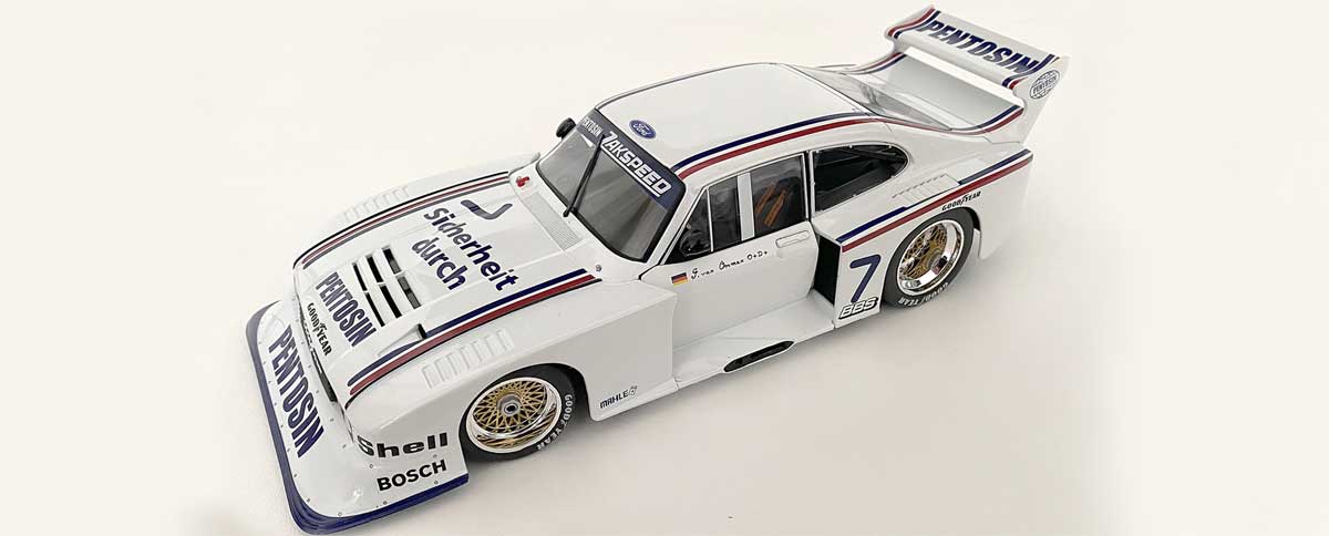 In einer Division fuhr der Zakspeed-Capri im Pentosin-Design seine finalen Runden. Am Steuer des Autos mit Diffusorschacht mit der Startnummer 7 Jörg van Ommen. In einer Division fuhr der Zakspeed-Capri im Pentosin-Design seine finalen Runden. Am Steuer des Autos mit Diffusorschacht mit der Startnummer 7 Jörg van Ommen.